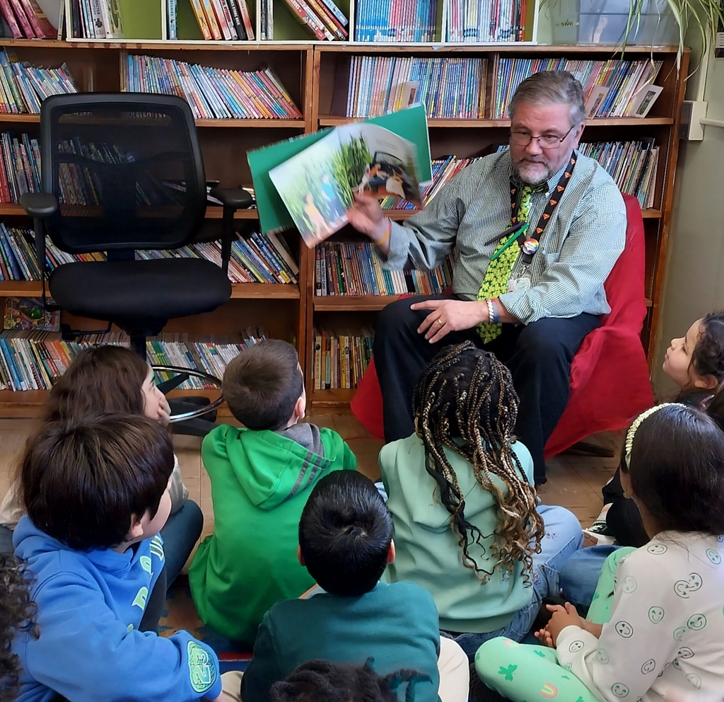 Mr. Shave reading to 3d grade students