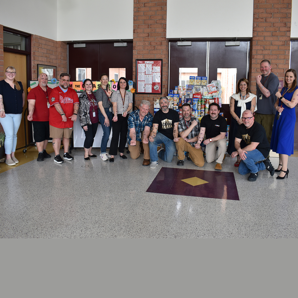 Image of UVMS staff that particpated in "Tattoo your Teacher", displaying their temporary tattoos.