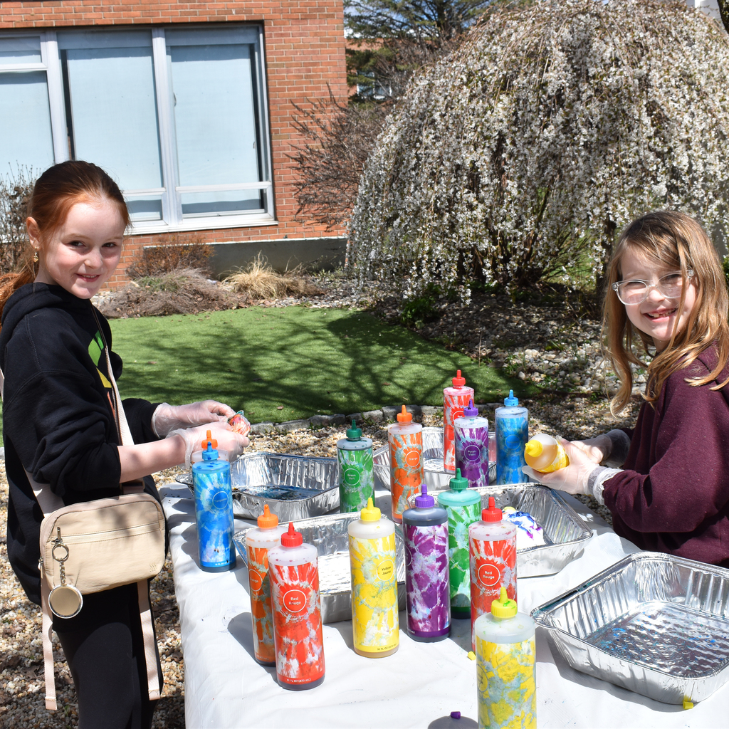 2 girls participating in tie-dyeing activity