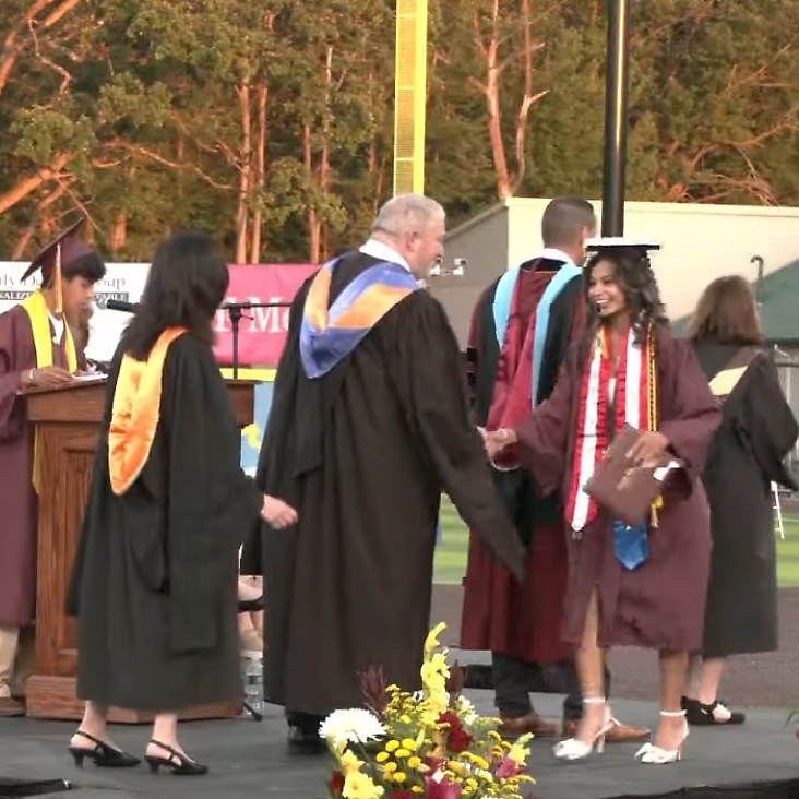 AHS graduate is congratulated 