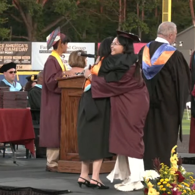 AHS graduating senior receives a hug