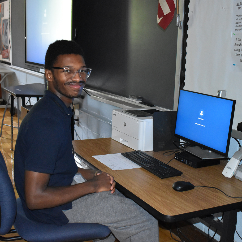 Student intern sitting at computer
