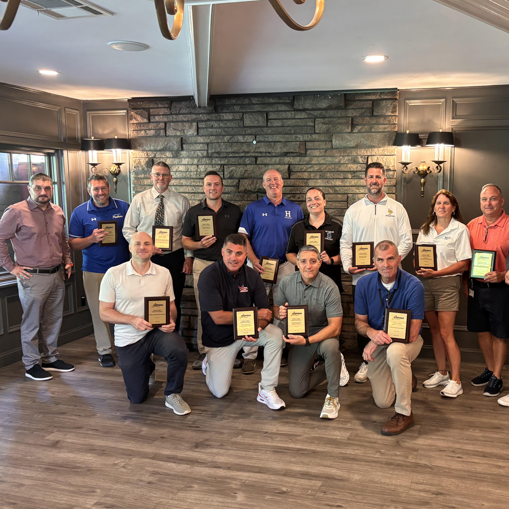 group of Athletic Directors displaying their School of Excellence plaques