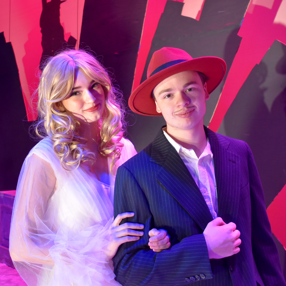 Alessandra Selden plays Miss Adelaide and Hunter Fryer plays Nathan Detroit in Arlington High School Drama’s production of “Guys and Dolls.”