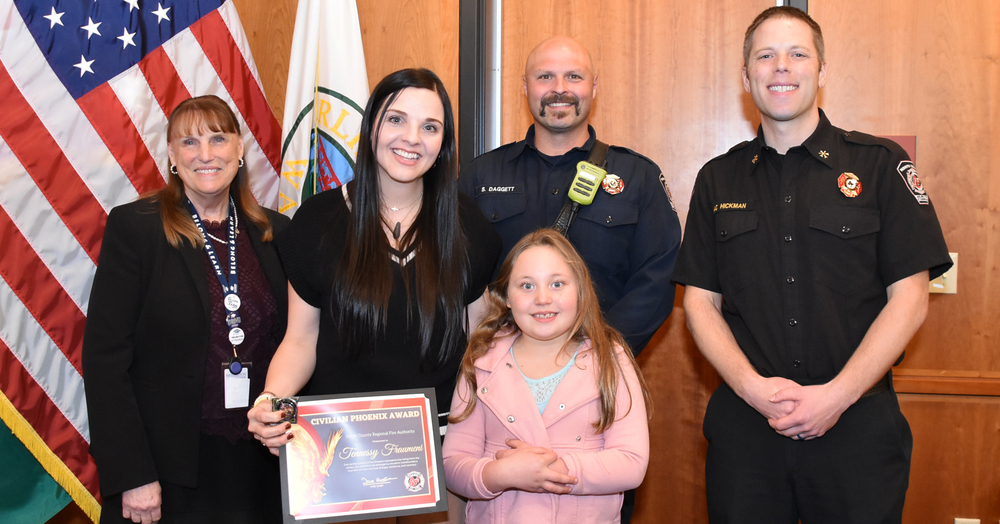 Stillaguamish Valley Learning Center second grade teacher Tennessy Fraumeni was recognized on Oct. 28 with the Civilian Phoenix Award from the North County Regional Fire Authority for saving a student’s life last spring. (Left to right) Dr. Chrys Sweeting, Arlington Public Schools Superintendent; Tennessy Fraumeni, Stillaguamish Valley Learning Center Second Grade Teacher; Naomi Brock, SVLC Student; Steven Daggett, Firefighter Paramedic; and Matthew Hickman, Assistant Chief of EMS.