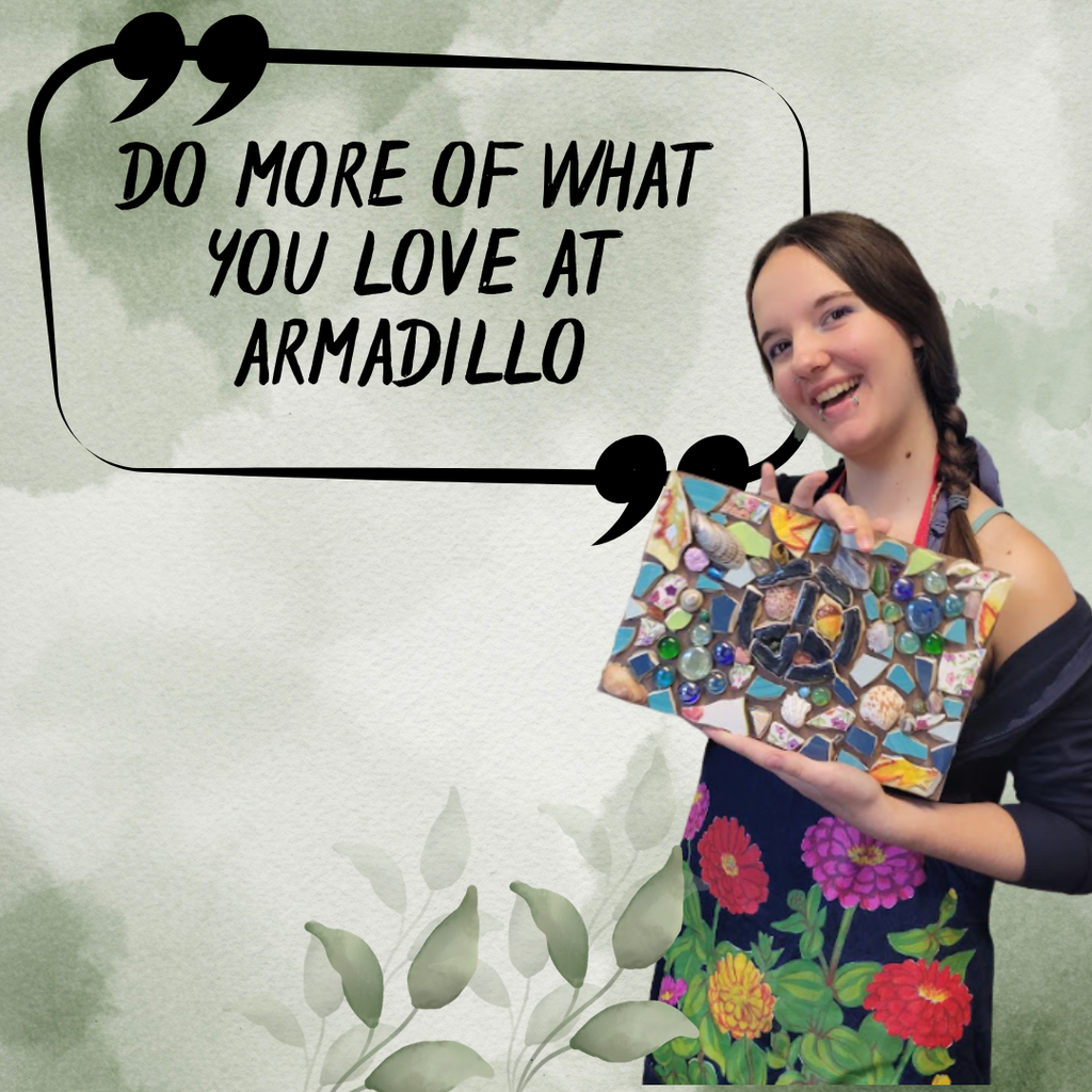Student holding mosaic of peace sign