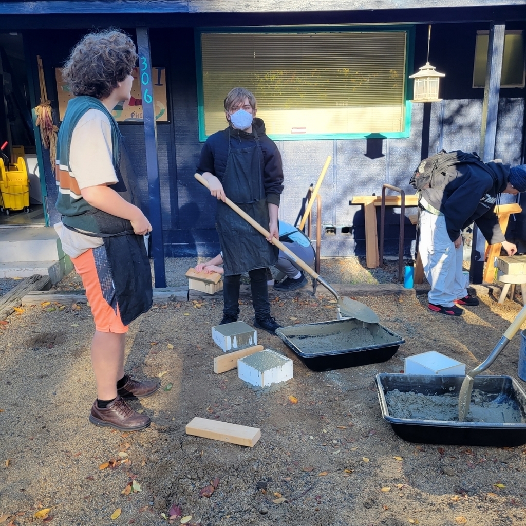 students creating cement tiles