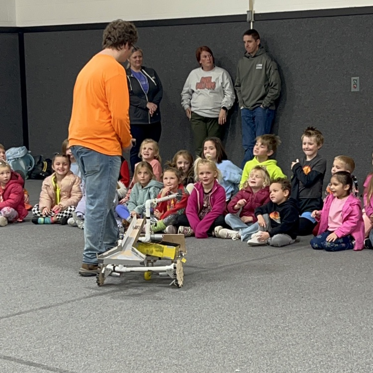 HS robotics student Richard Morrissette showing off the HS robot