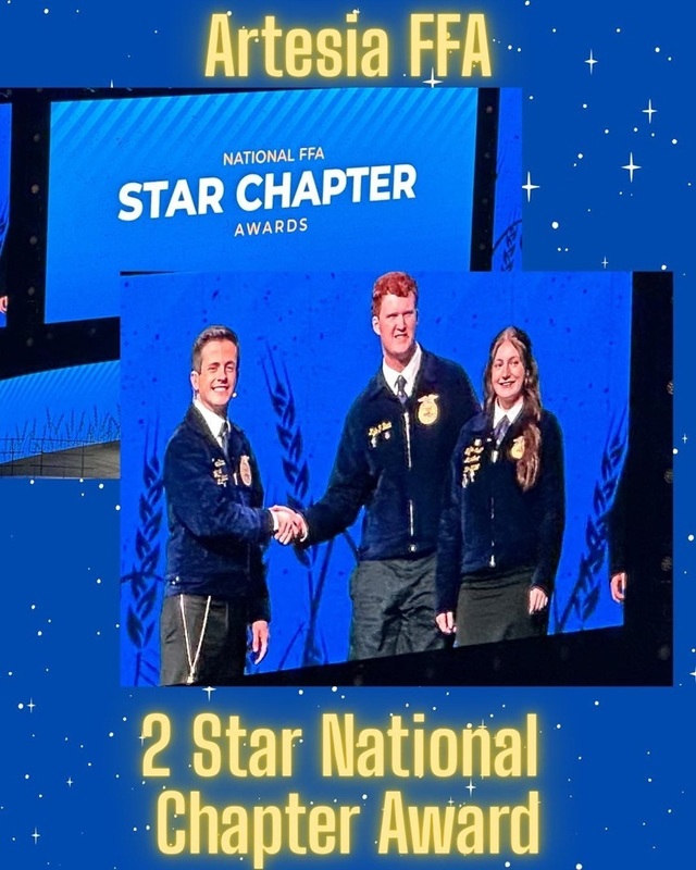 A male teen in an FFA jacket shakes hands with an FFA representative as a female teen stands alongside him.