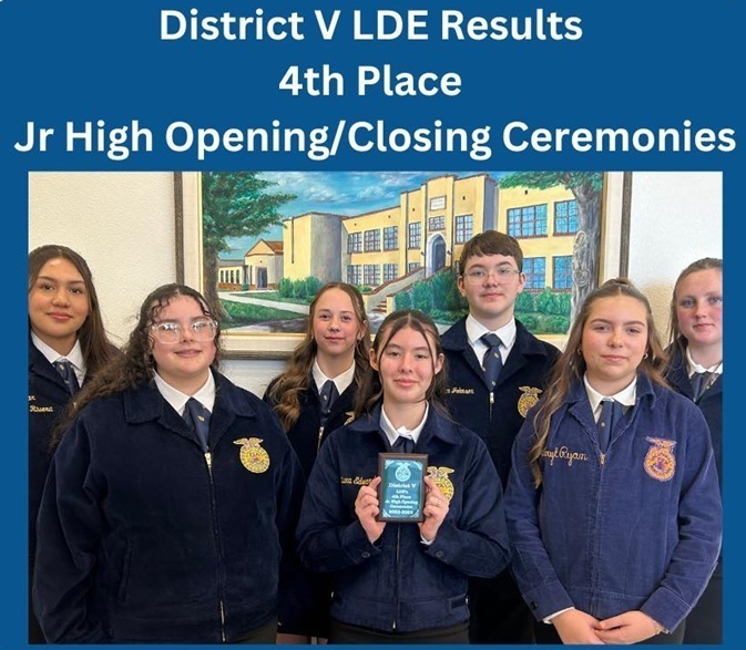 Six teen girls and one teen boy pose for a photo in front of a painting of a school building. One girl holds a small blue plaque.
