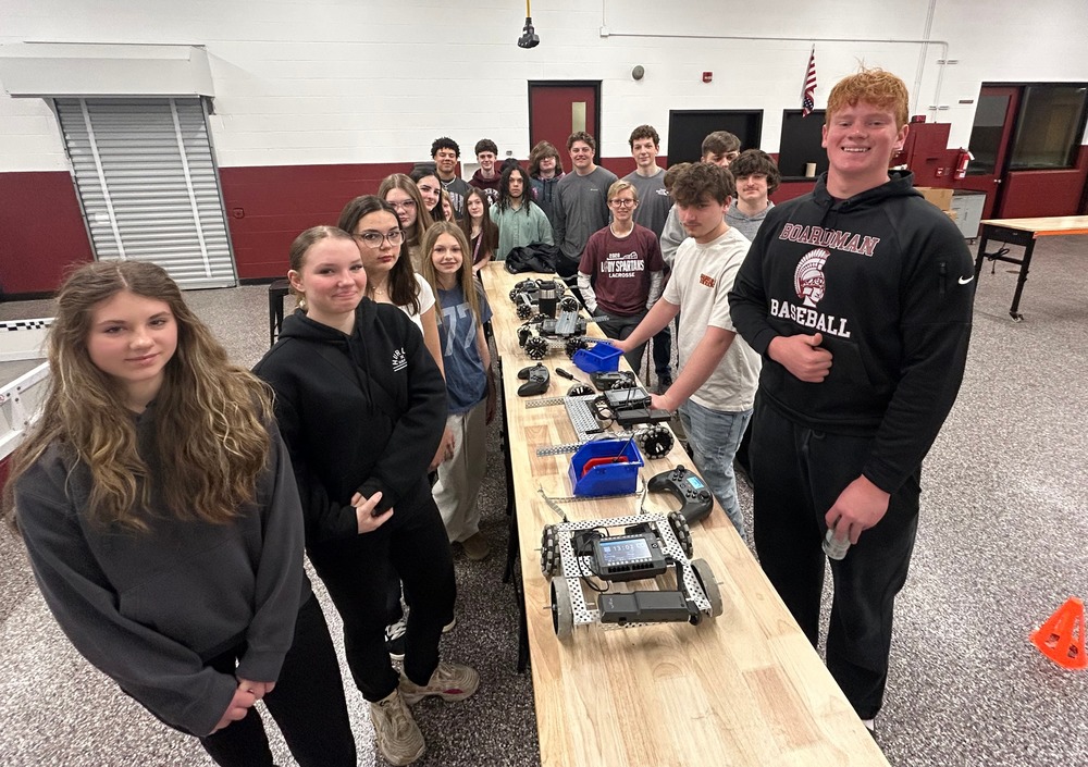 8th grade and high school students with robotics in STEAM Lab
