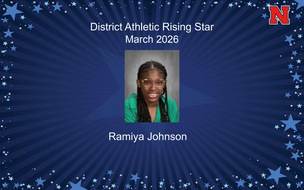 An award graphic titled "District Athletic Rising Star March 2026" featuring a portrait of Ramiya Johnson, a young girl with braided hair and glasses wearing a green shirt. The background is a dark blue sunburst pattern framed by light blue stars, with a red and white "N" logo in the top right corner.