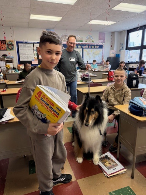 student with therapy collie