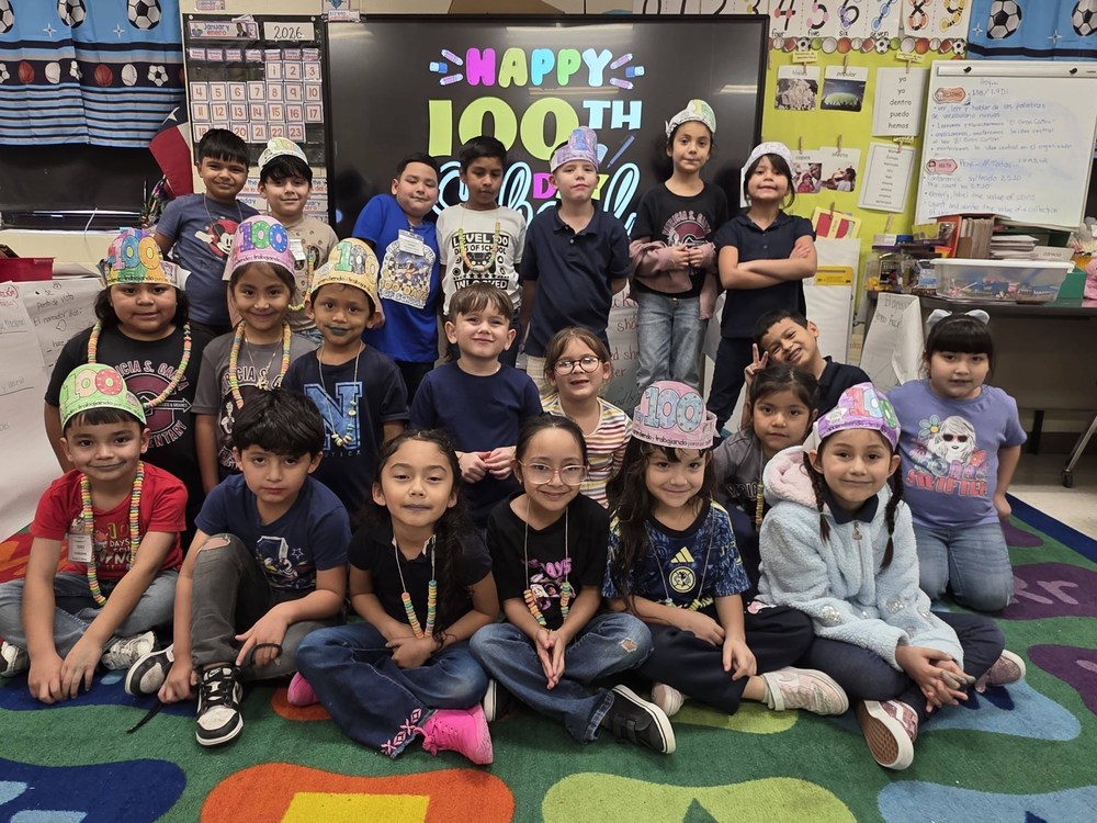 students seated on carpet