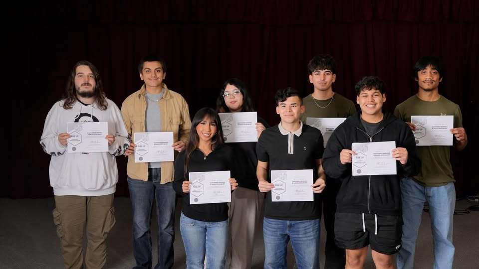 students holding certificates