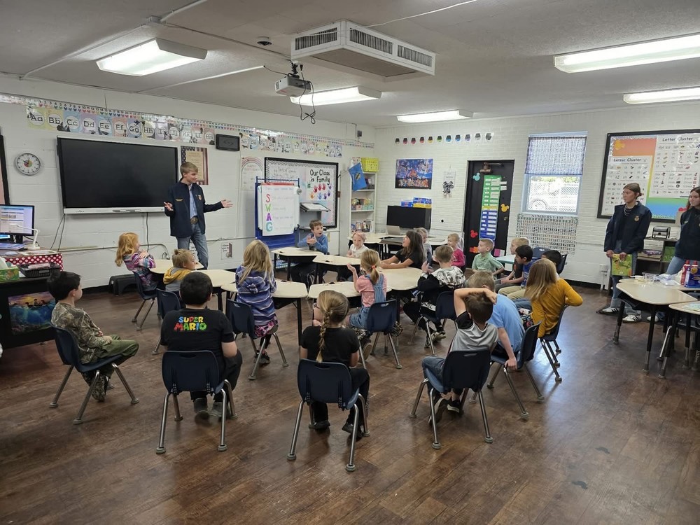 Austin presents pumpkins.