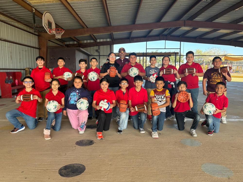 R.E.A.D.Y. students received equipment from Coach Rivera.