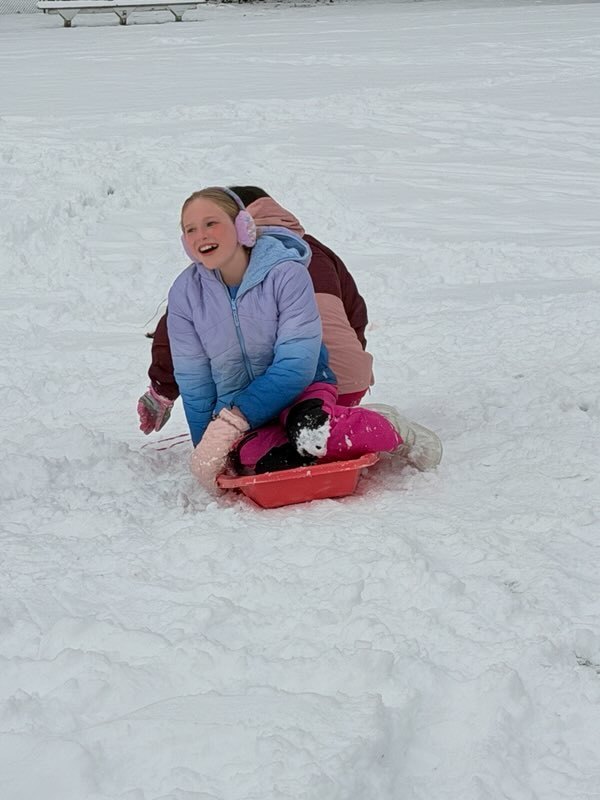 girls sledding