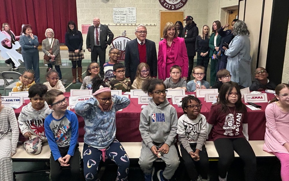 Governor Dewine and Fran with several students who received eyeglasses through OhioSee