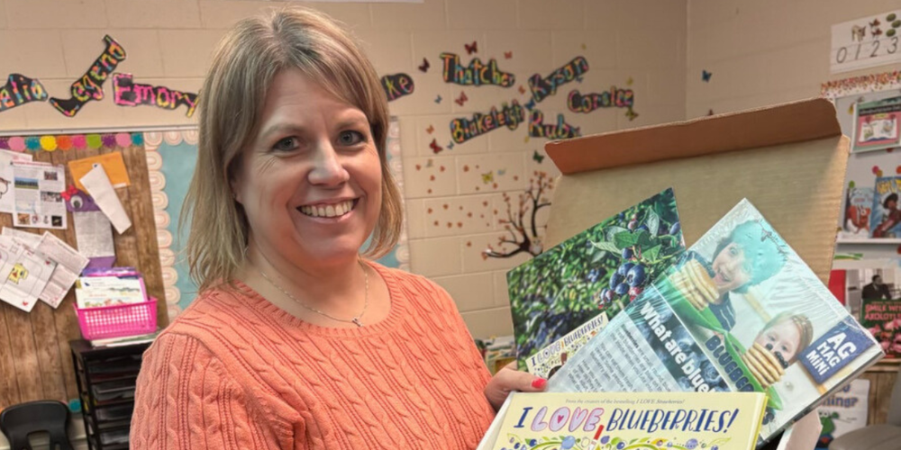 Mrs. Rustin with her grant books