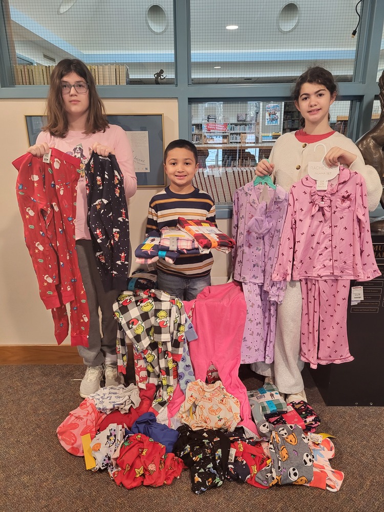 3 UE Students with doanted pajamas