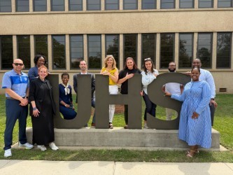 school represatives from 3 university campus standing together