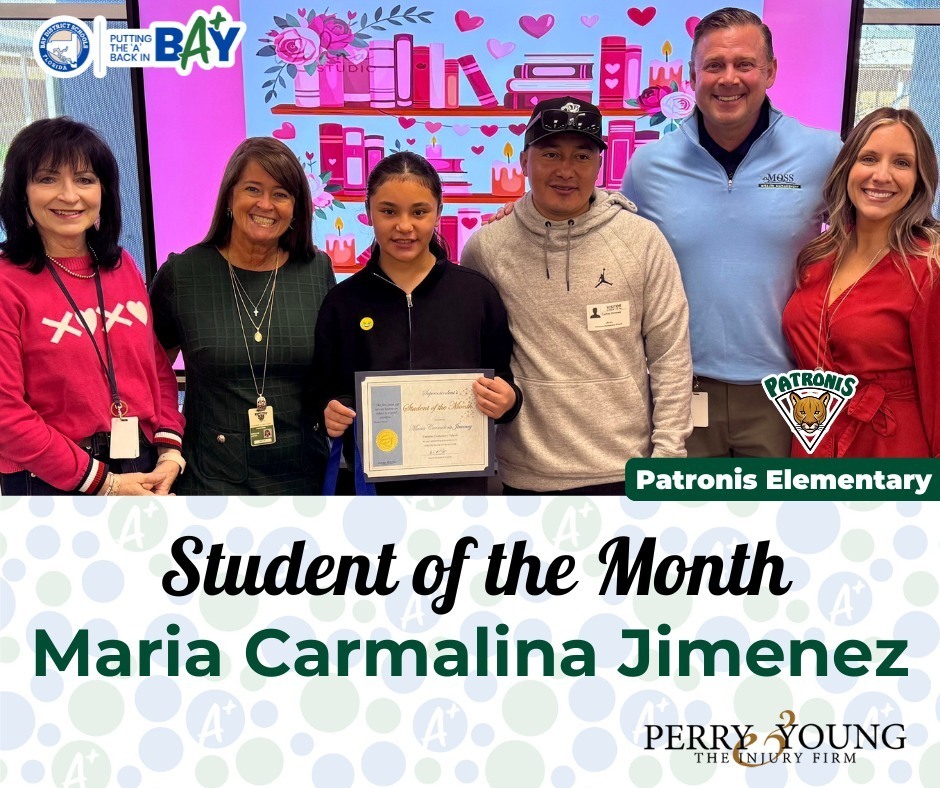 A group of adults and one student in front  of a pink board and the student is holding an award. The text on the image reads "Student of the Month: Maria Carmalina Jimenez"