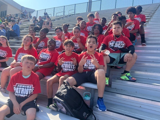 Group of students wearing matching shirts