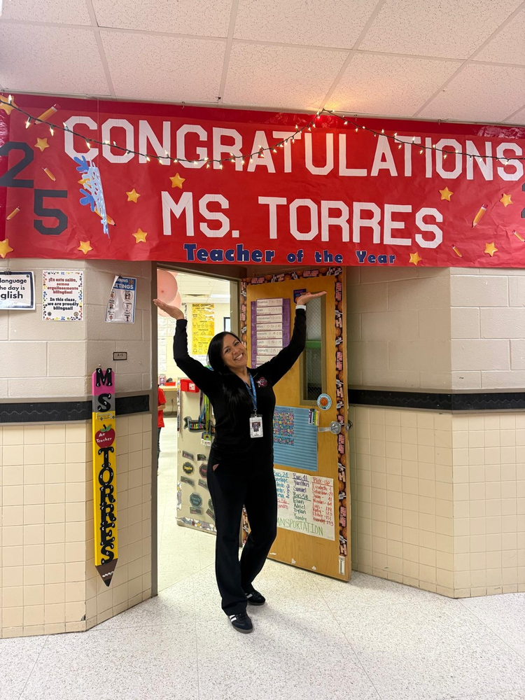 teacher with arms up