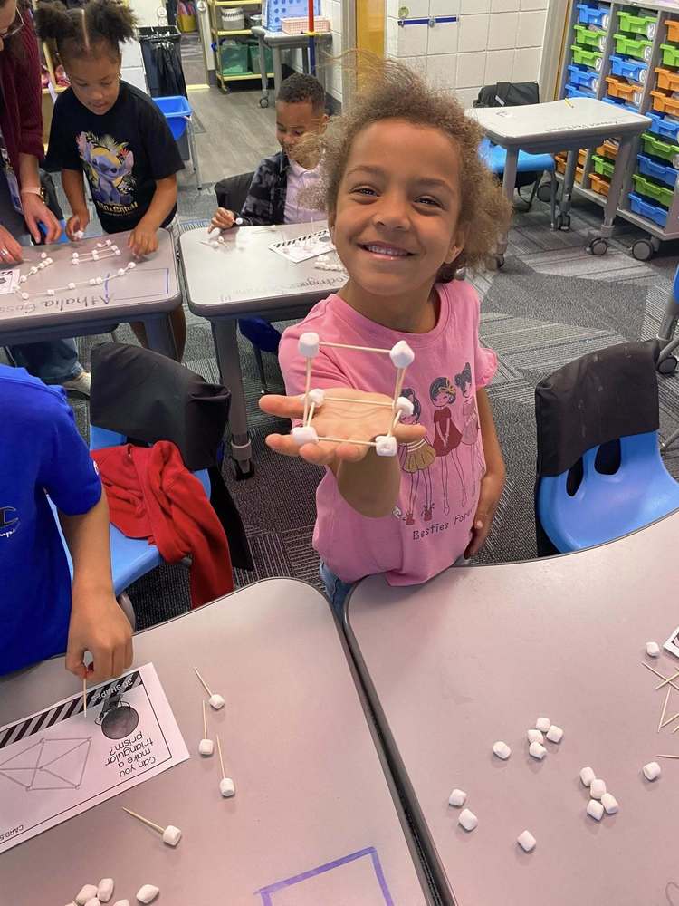 Student holding project