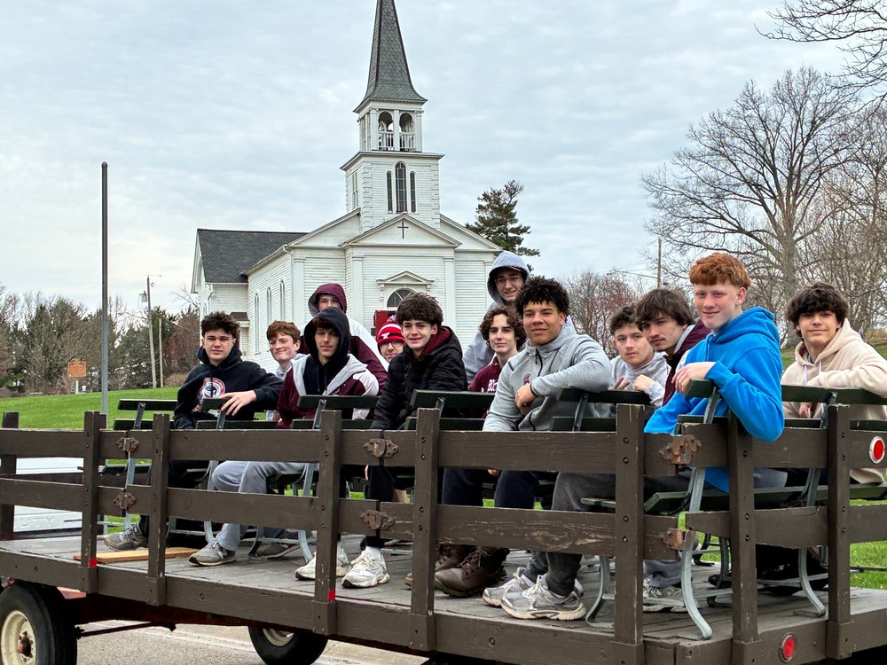 Boys Lacross Team members  volunteering at Boardman Park