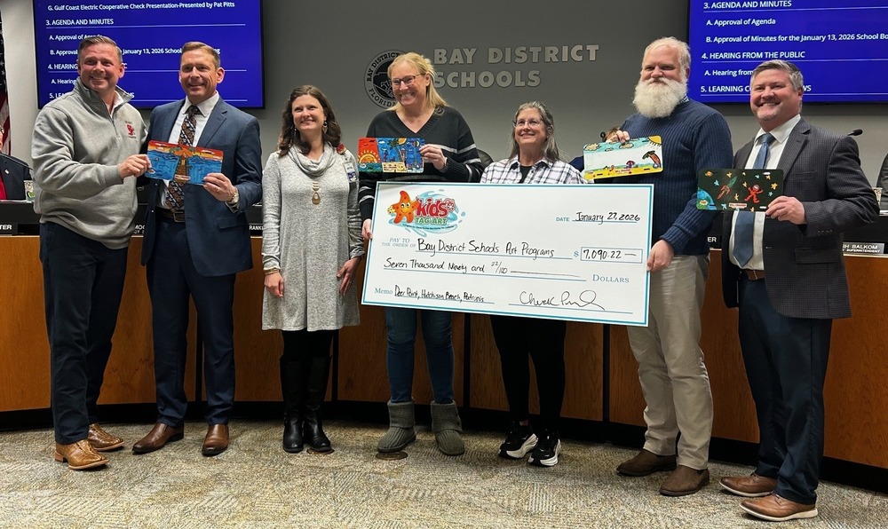 Check for 7,090 presented to schools