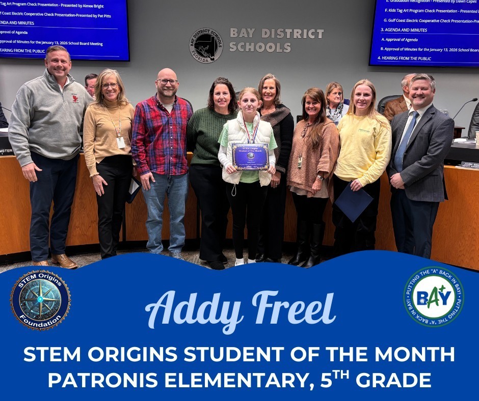 A group of adults and one student in a school board room, and the student is holding a plaque. The graphic says "Addy Freel STEM Origins Student of the Month, Patronis Elementary, 5th Grade"