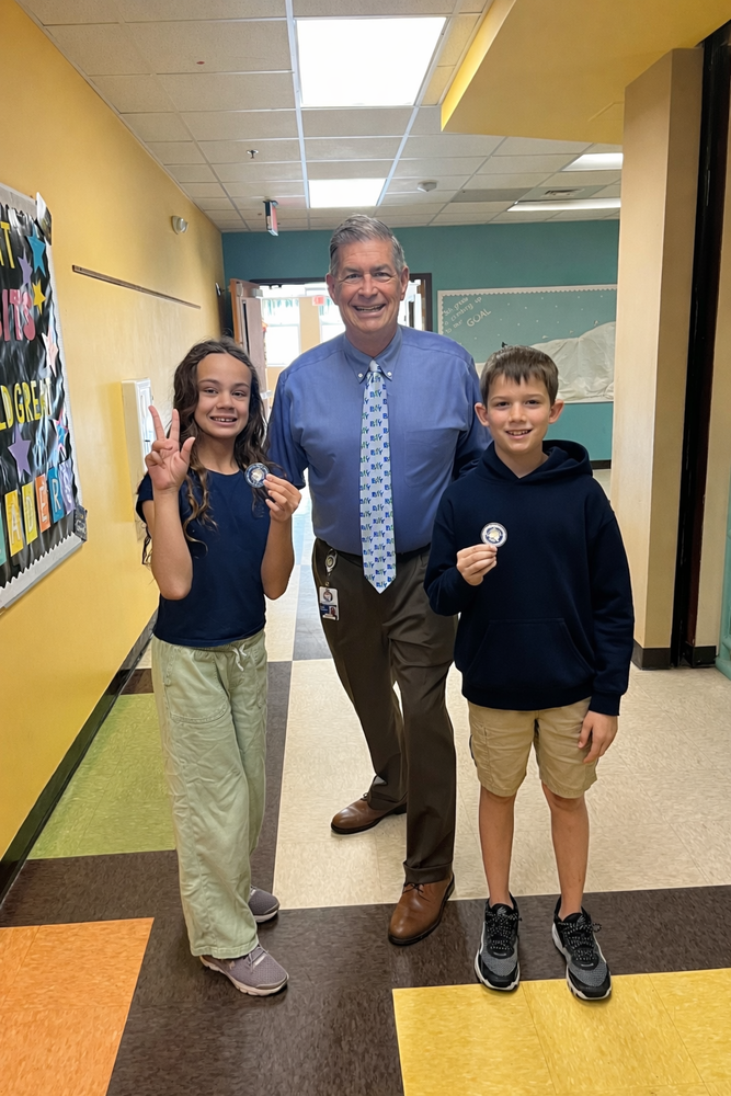 Mr. McQueen with Branch and Zoe and their Coins of Excellence