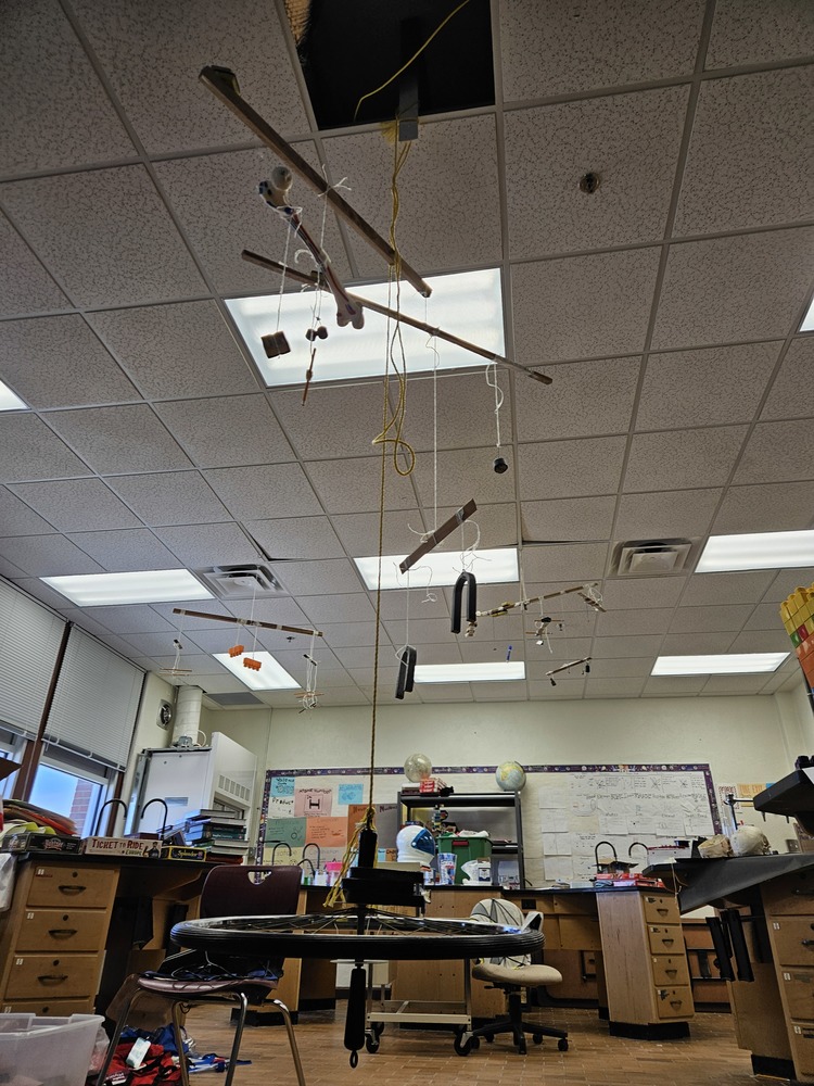 Hanging display of objects from the ceiling showing balance and equilibrium.