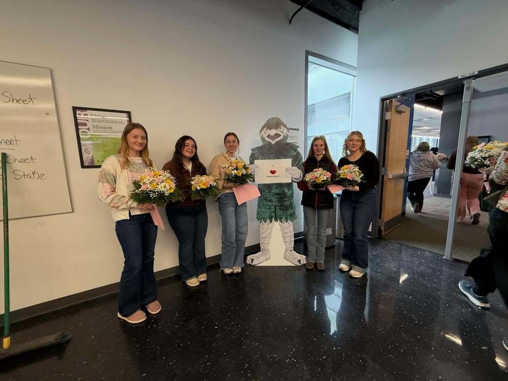 people smiling with flowers