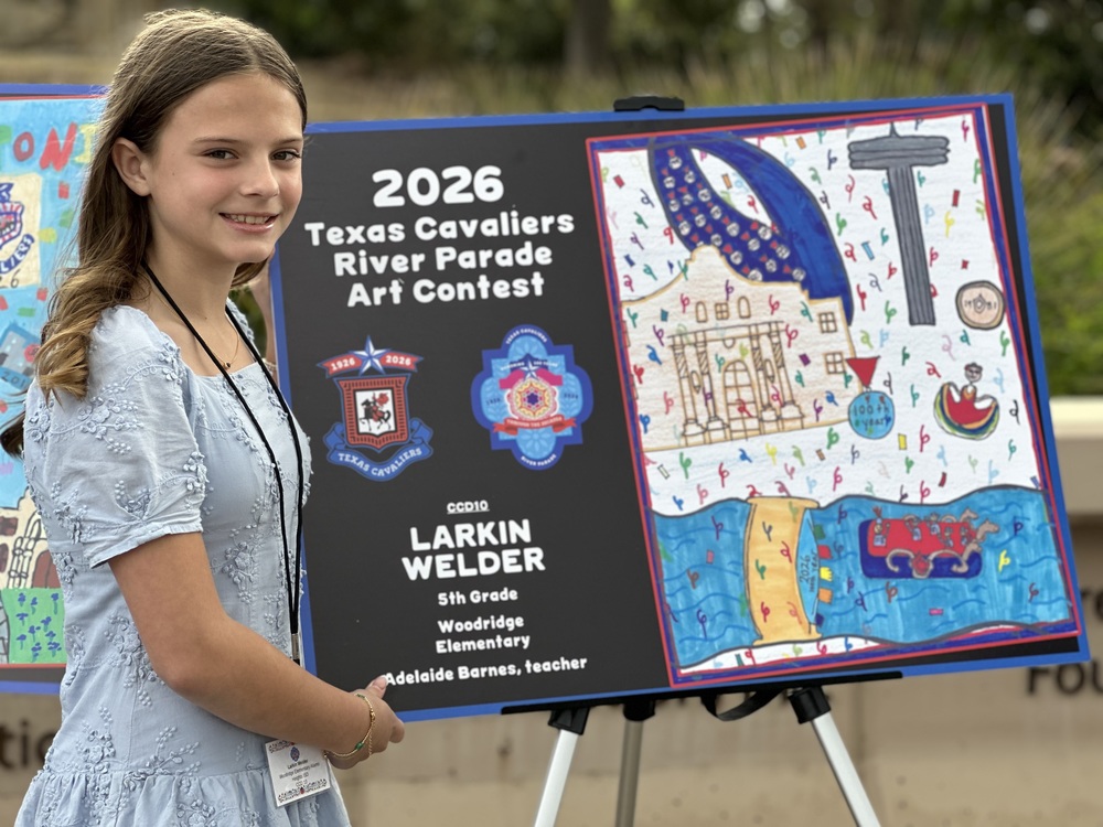 Student poses with art