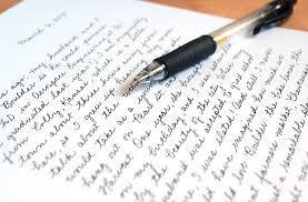 This image depicts a paper with handwriting notes and a pen.