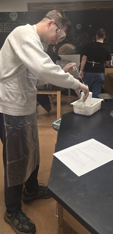 Student working diligently on experiment