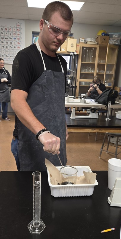 Student doing science experiment