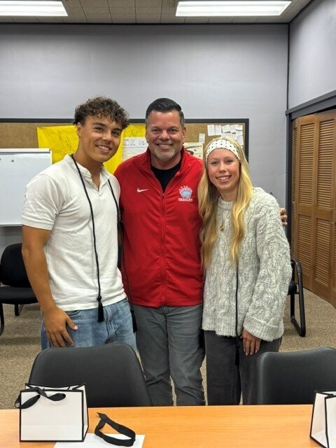 Students standing with the Superintendent