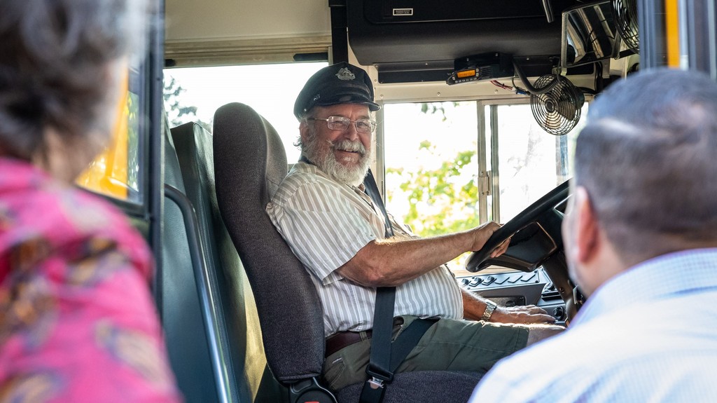 Bus driver, Stefan Windroth, greeted by Principal Atanes and Superintendent Hattrick