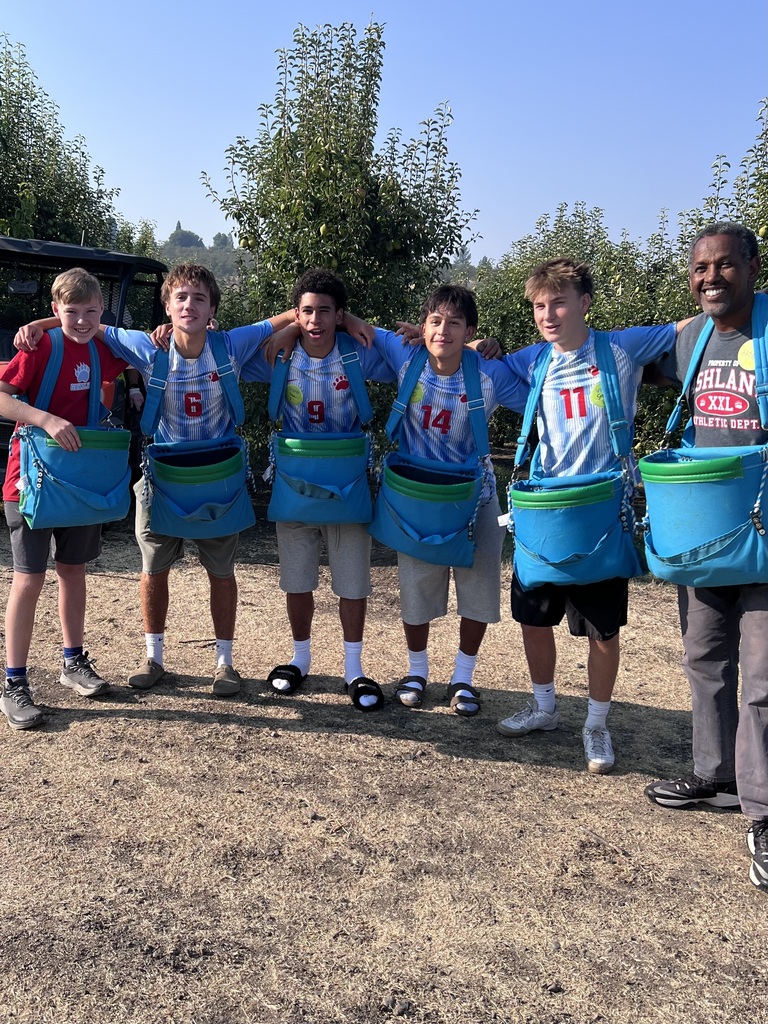 Soccer players lined up with pear bags