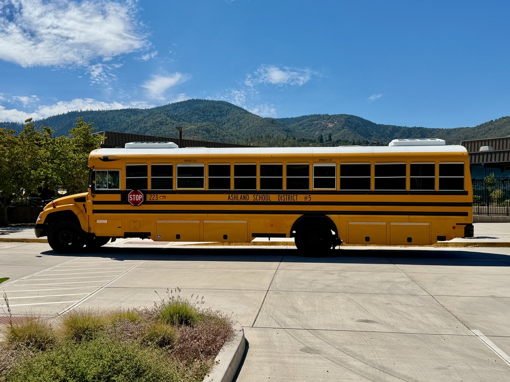 School Bus, mountains behind