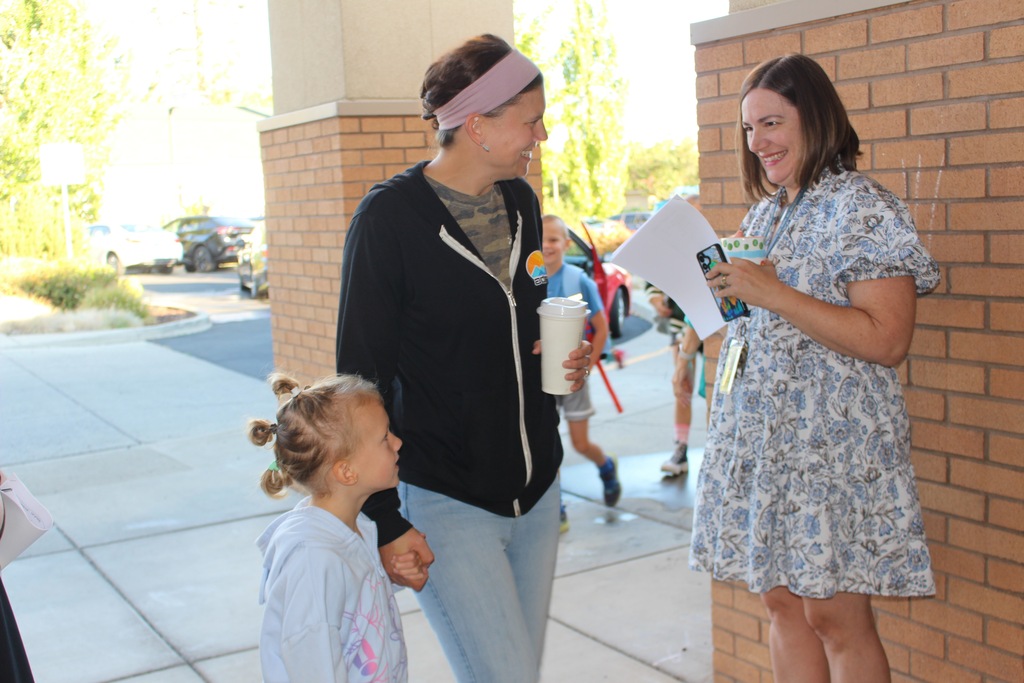 Principal greets families
