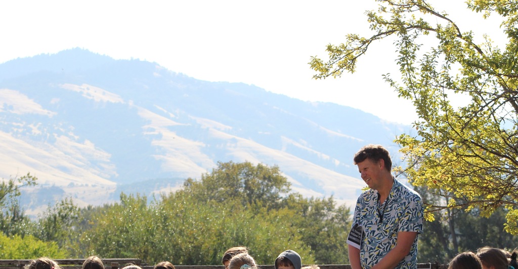 Hills in background, circle students