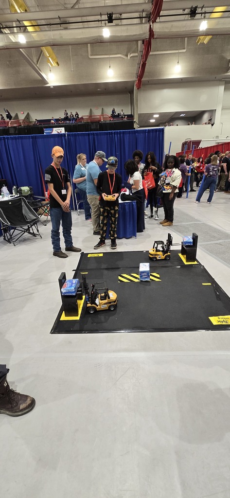 Students using the robots to complete a task