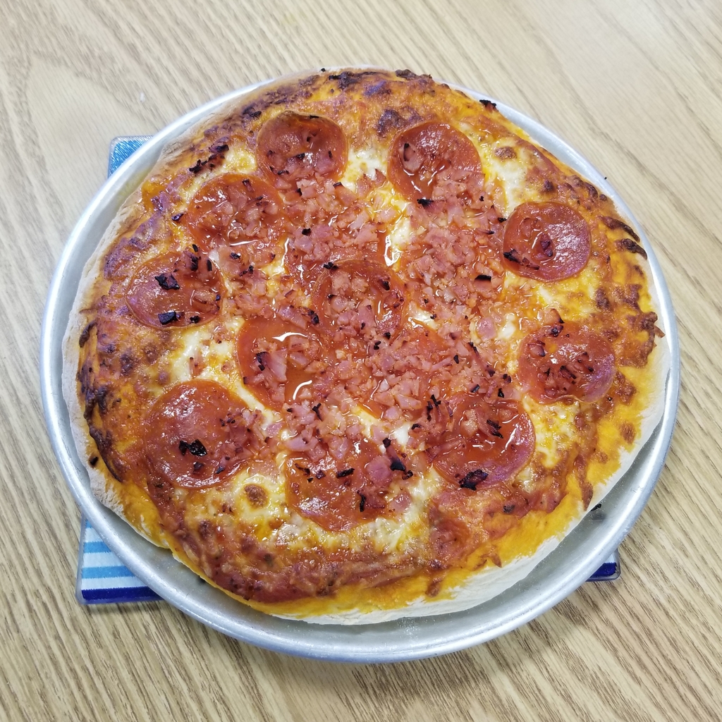 Meatlover's pizza fresh out of the oven.