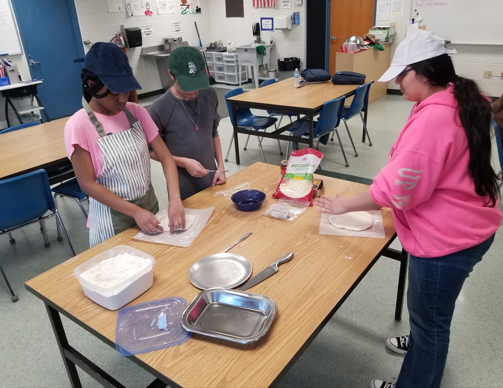 Skylar Redmond, Robert Cancino Dennis and Nom'Aria Barajas making pizzas for our custodial staff.