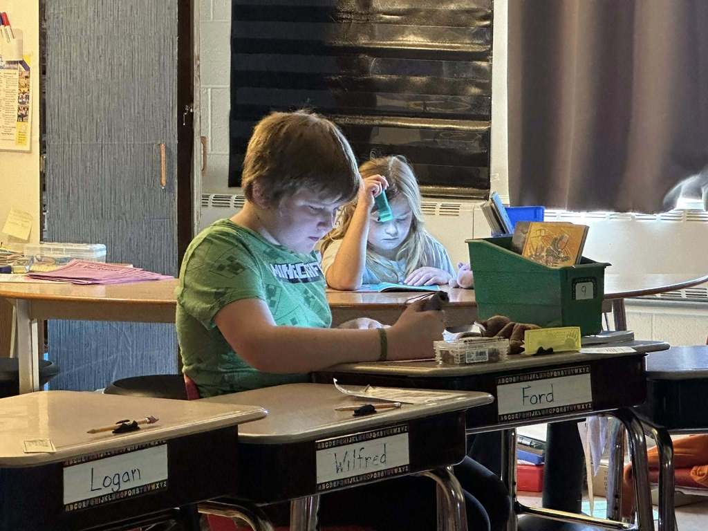 Students reading with flashlights